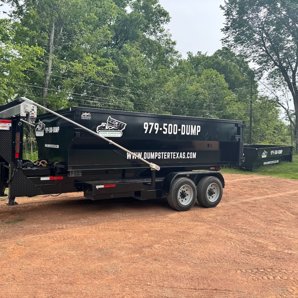 Texas Dumpster roll off dumpster loaded on a delivery trailer